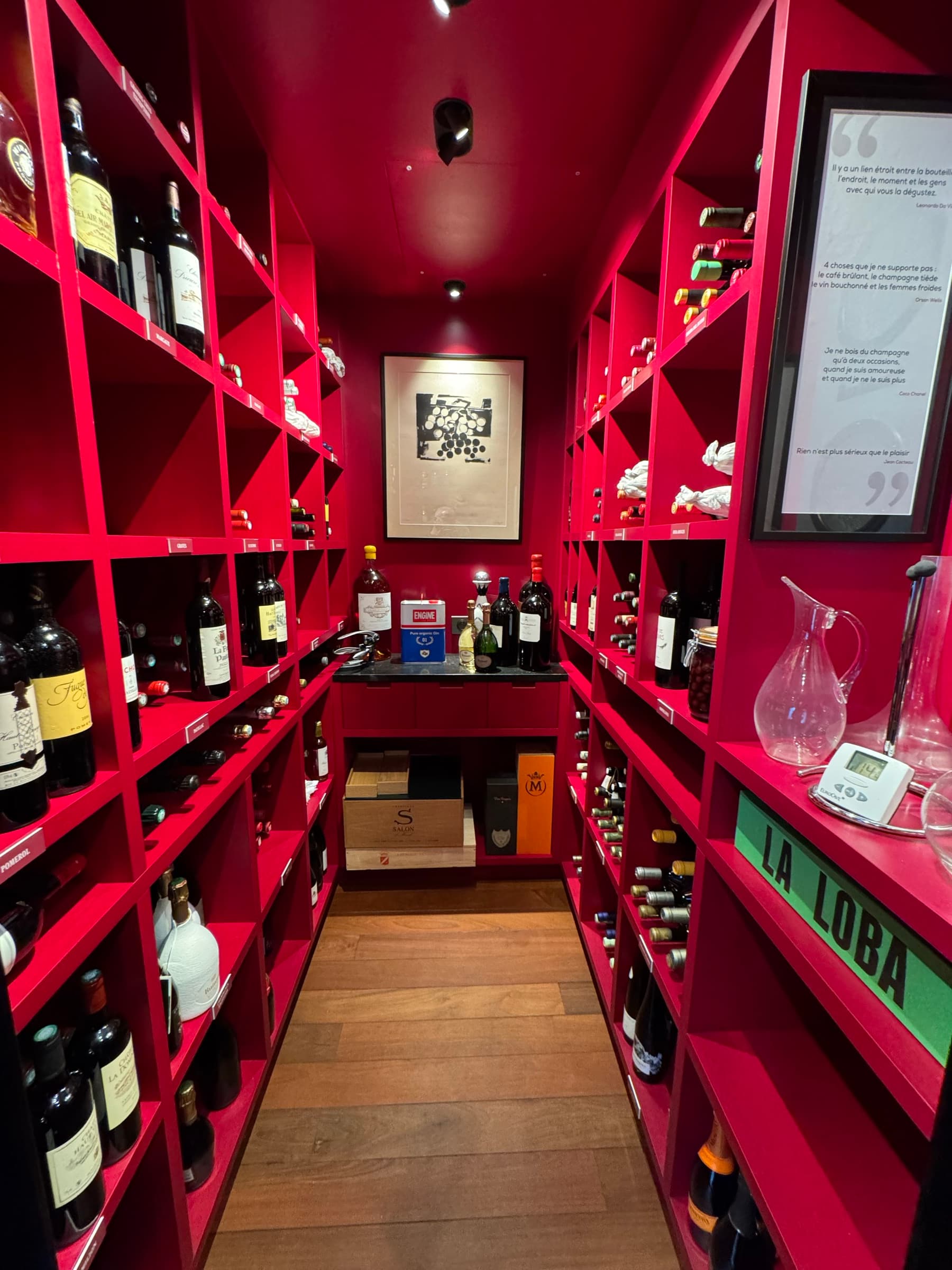 Walk-in wine cellar aisle with floor-to-ceiling bottle racks